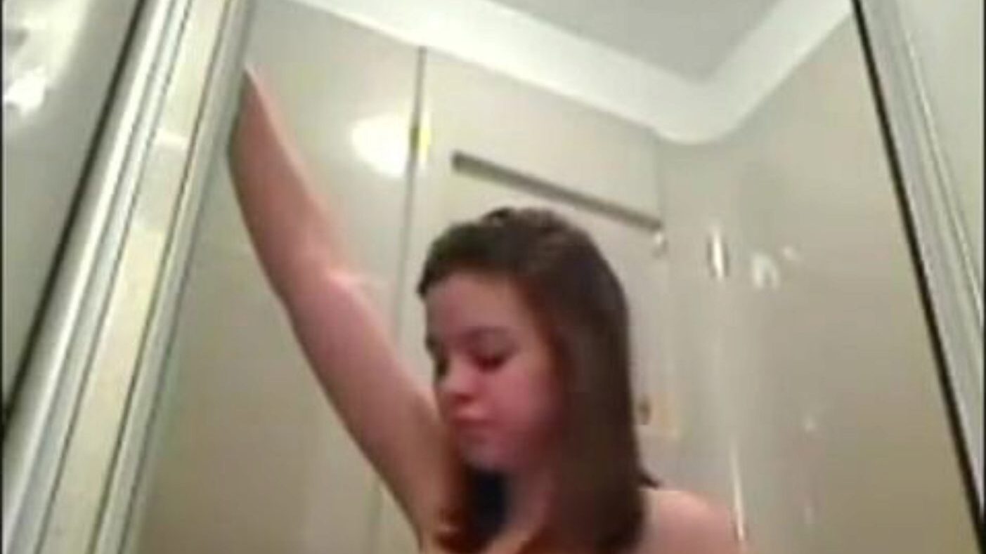 Honey with big perky nipps takes a douche
